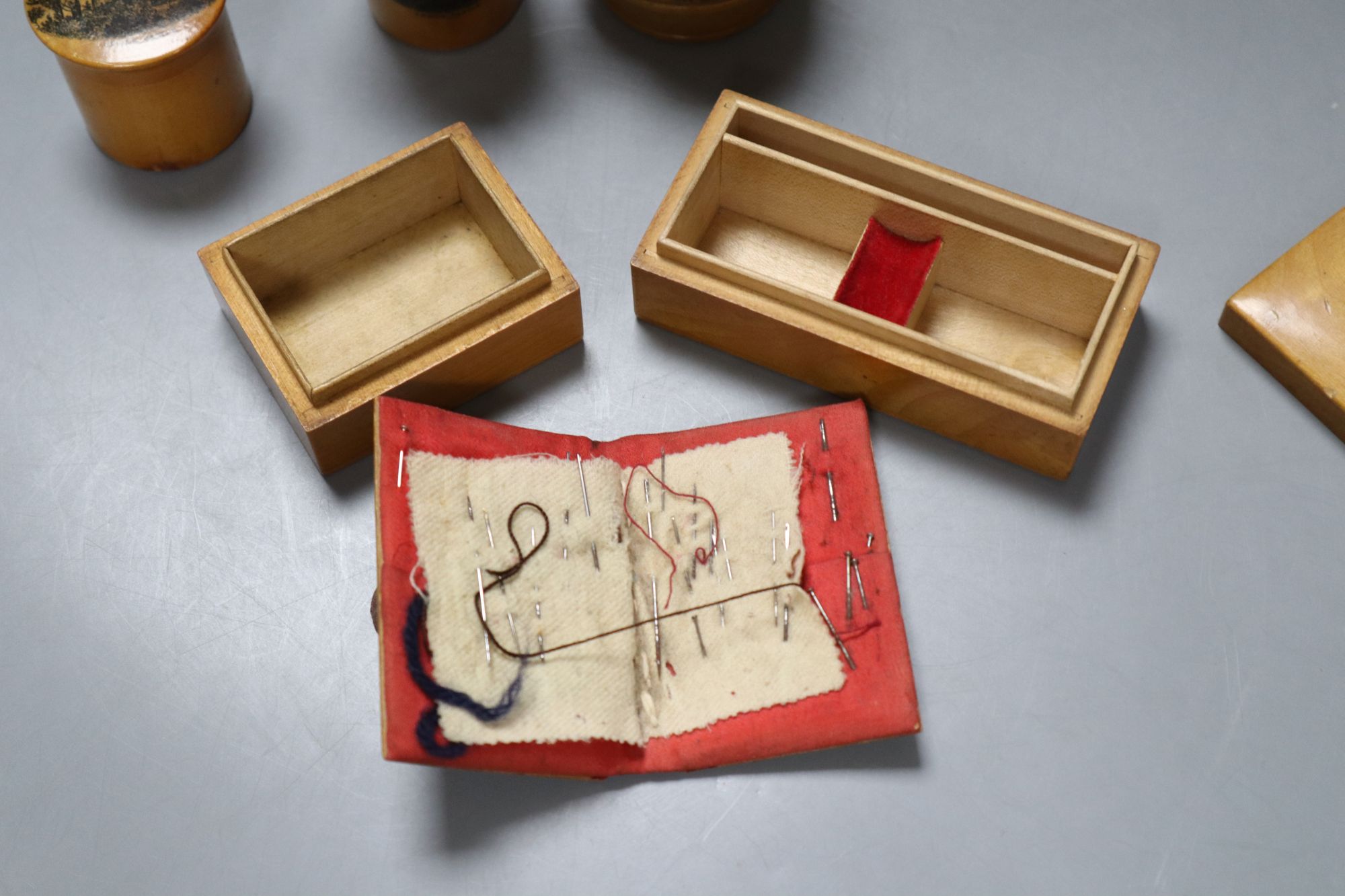 Six pieces of Mauchline ware including a money box, height 8cm